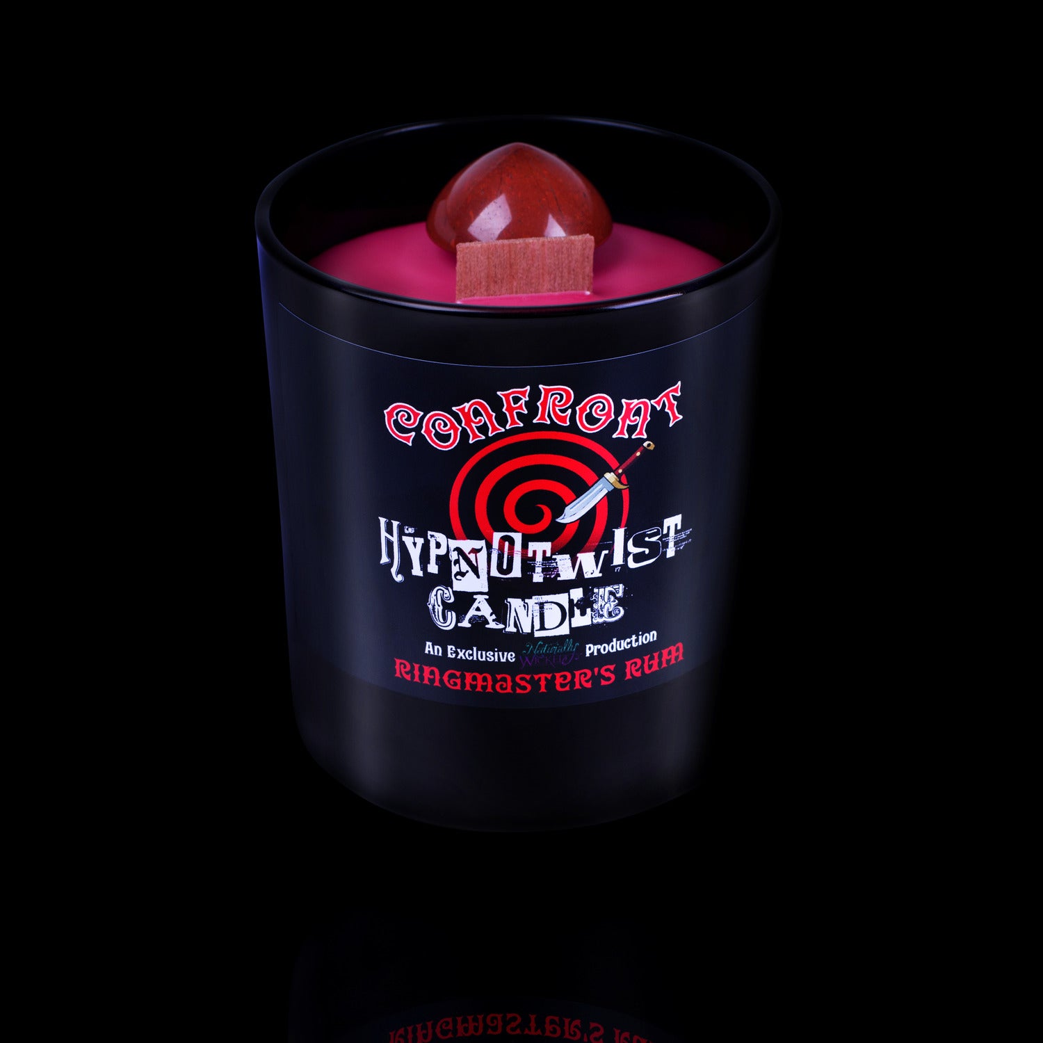 Naturally Wicked Hypnotwist Confront Candle Featuring Plant-based Soy Red Wax Scented with Ringmaster's Rum & Includes A Red Jasper Crystal Spinning Top.
